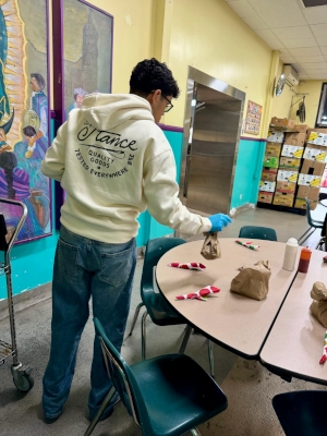 A volunteer preparing a table.
