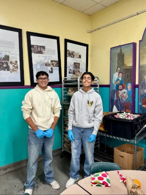 Two youth volunteers, smiling